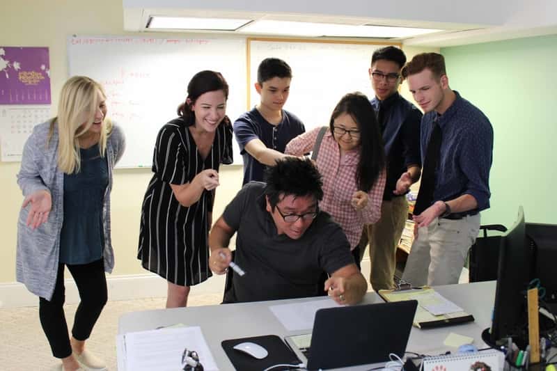 Colleagues working together on laptops